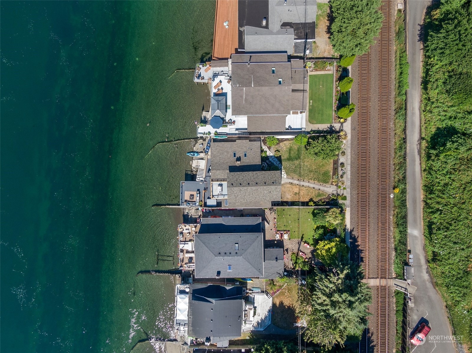4234 Sunset Beach Road University Place, WA 98466 - Photo 36 of 40 an aerial view of a house with outdoor space pool seating area and yard