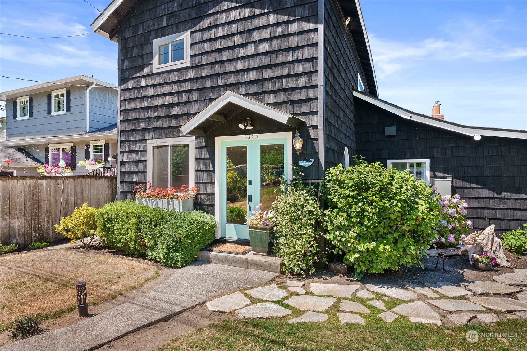 4234 Sunset Beach Road University Place, WA 98466 - Photo 39 of 40 a front view of a house with garden