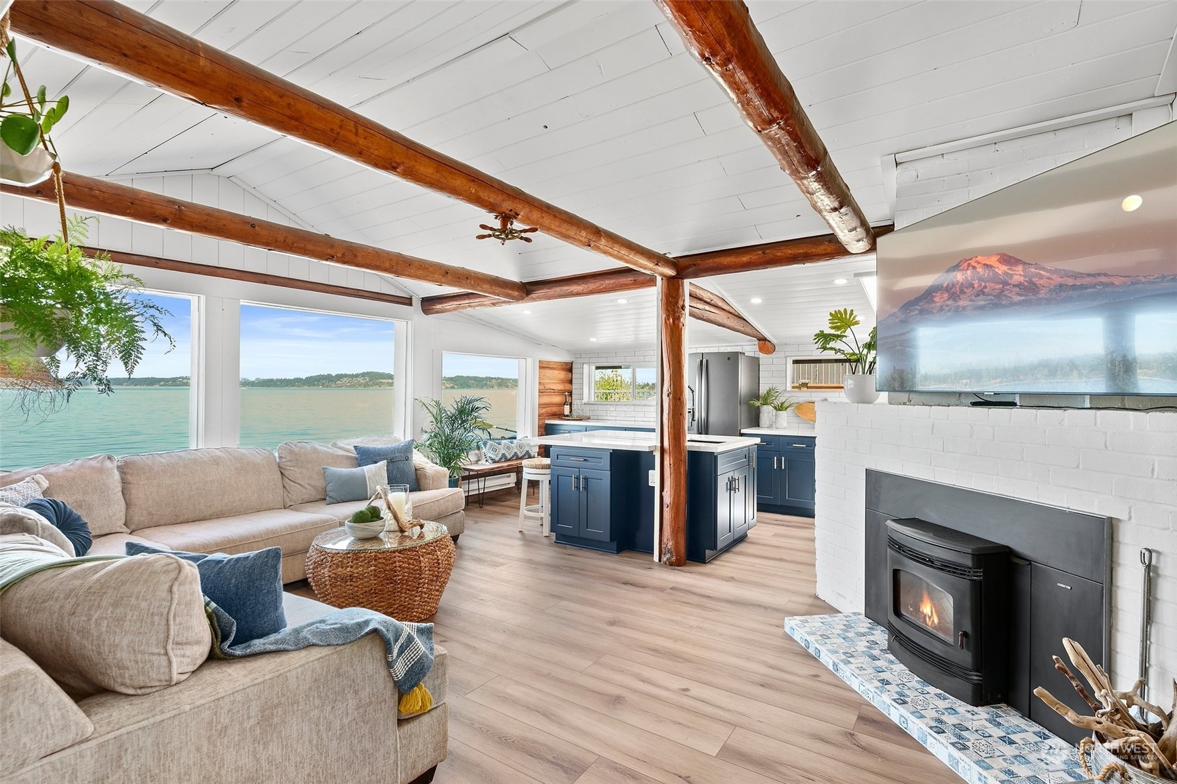 4234 Sunset Beach Road University Place, WA 98466 - Photo 7 of 40 a living room with furniture and a fireplace