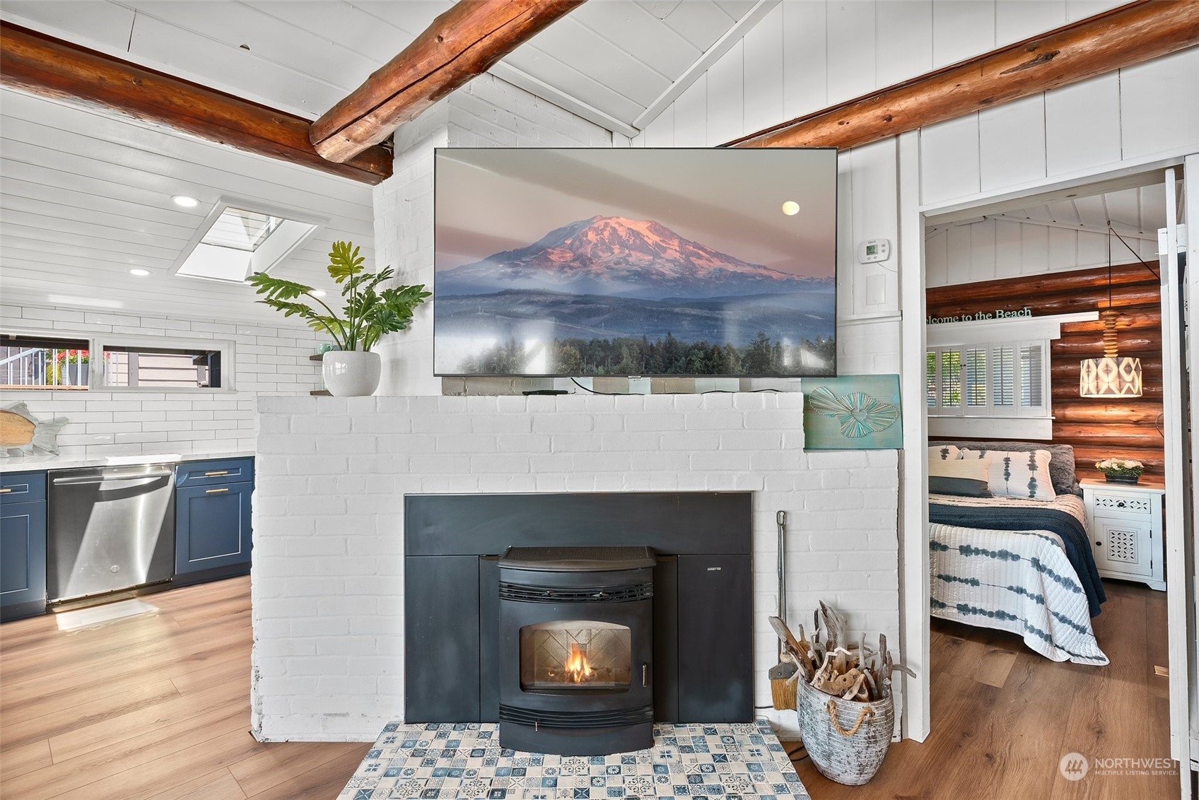 4234 Sunset Beach Road University Place, WA 98466 - Photo 8 of 40 a living room with furniture and a fireplace