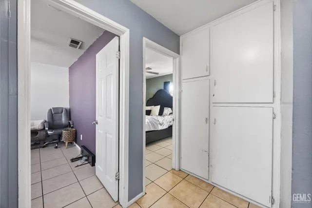 a room with a dresser and a mirror