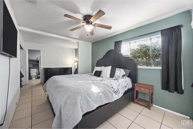 a bathroom with a toilet a sink and glass door