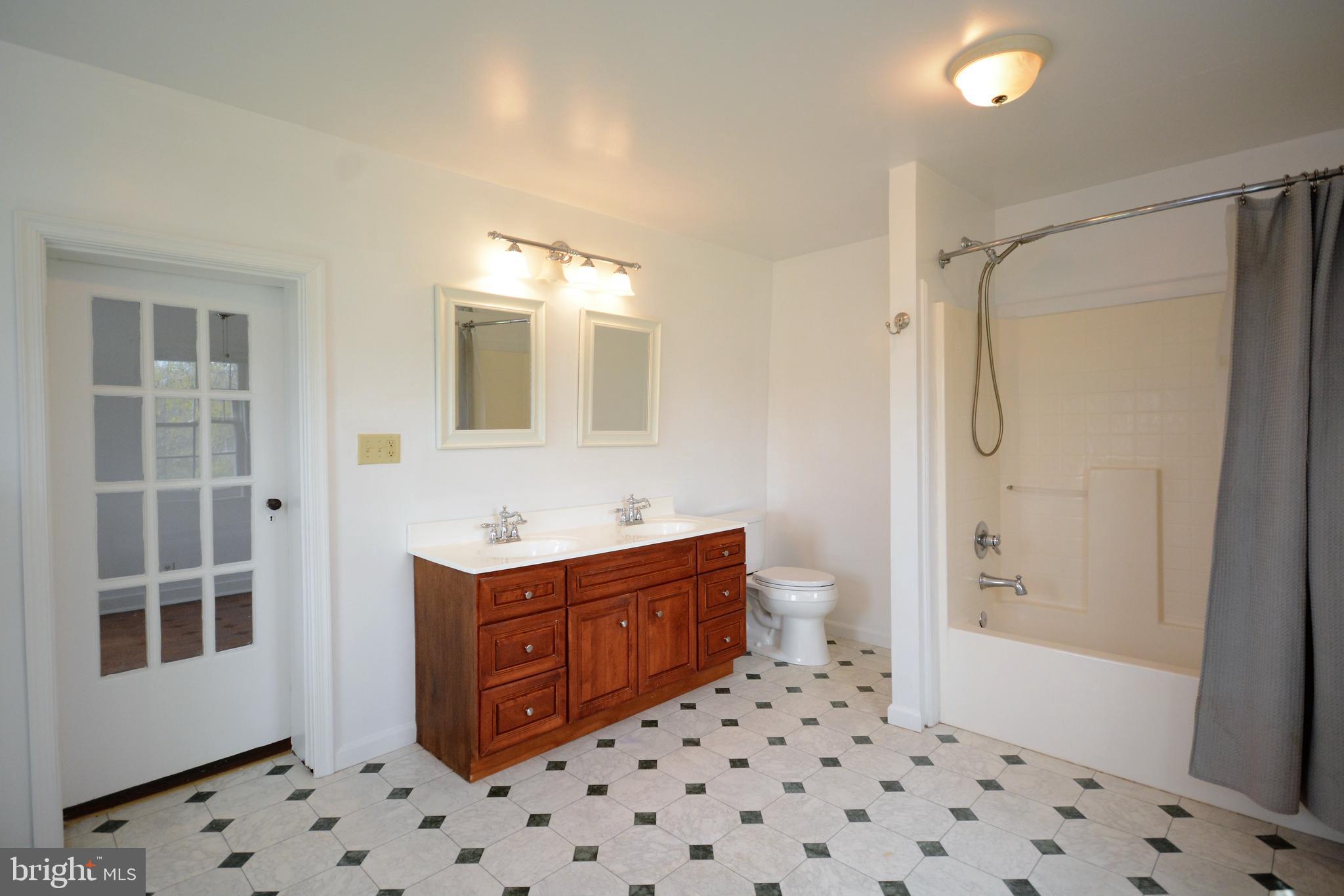 12108 Auburn Road Thurmont, MD 21788 - Photo 14 of 33 a bathroom with a sink a toilet and shower