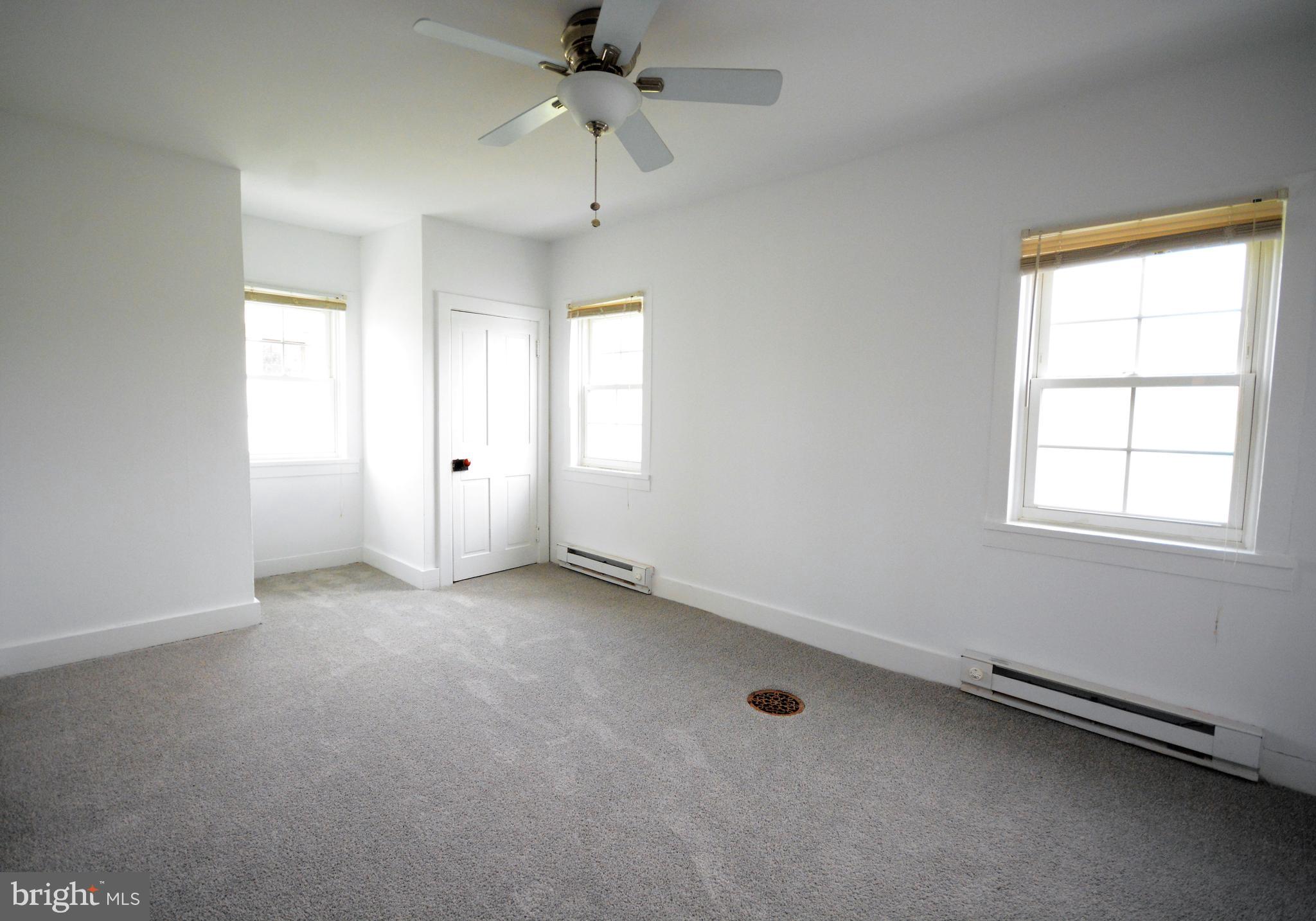 12108 Auburn Road Thurmont, MD 21788 - Photo 17 of 33 wooden floor in an empty room with a window