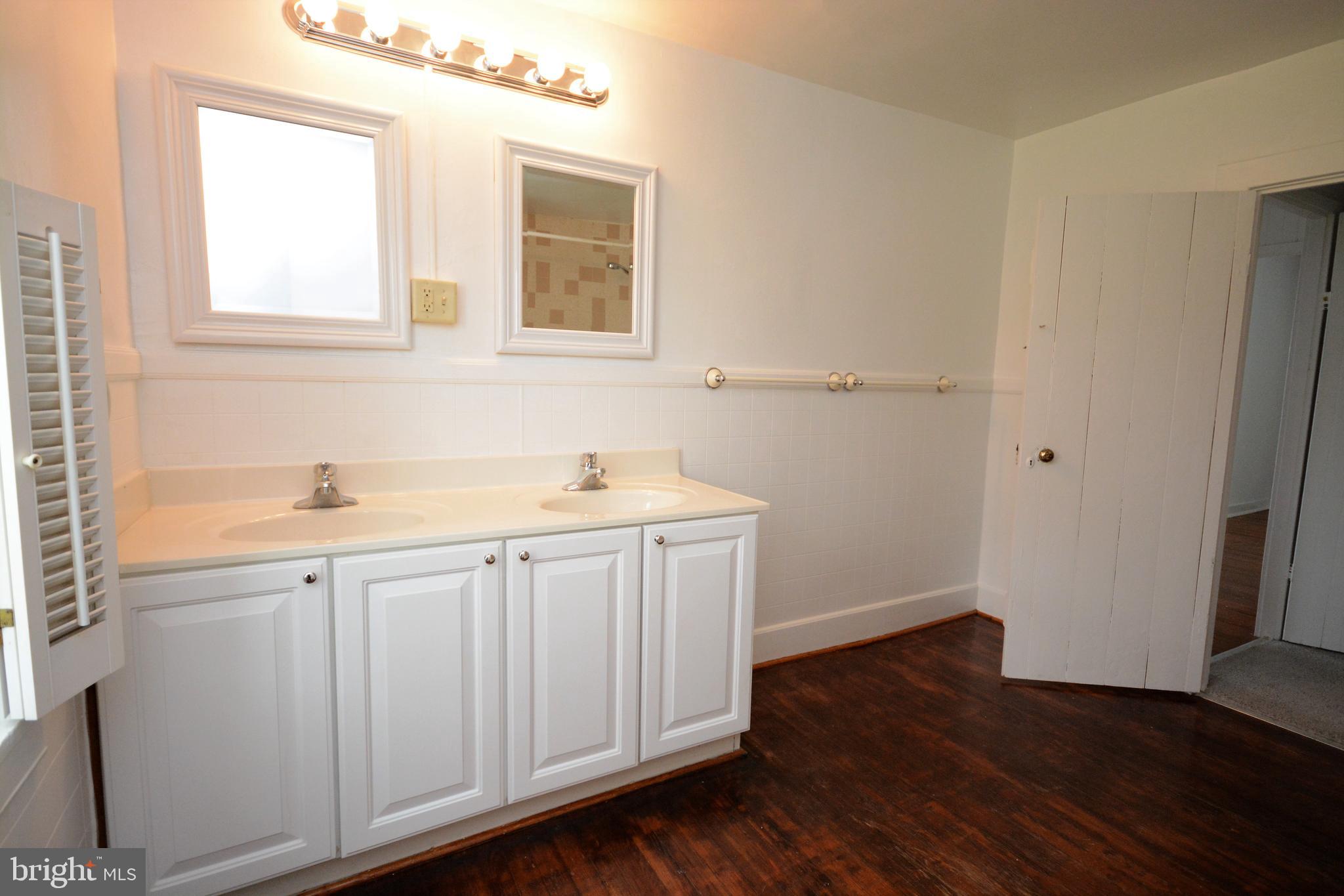 12108 Auburn Road Thurmont, MD 21788 - Photo 23 of 33 a room with a sink cabinets and a window