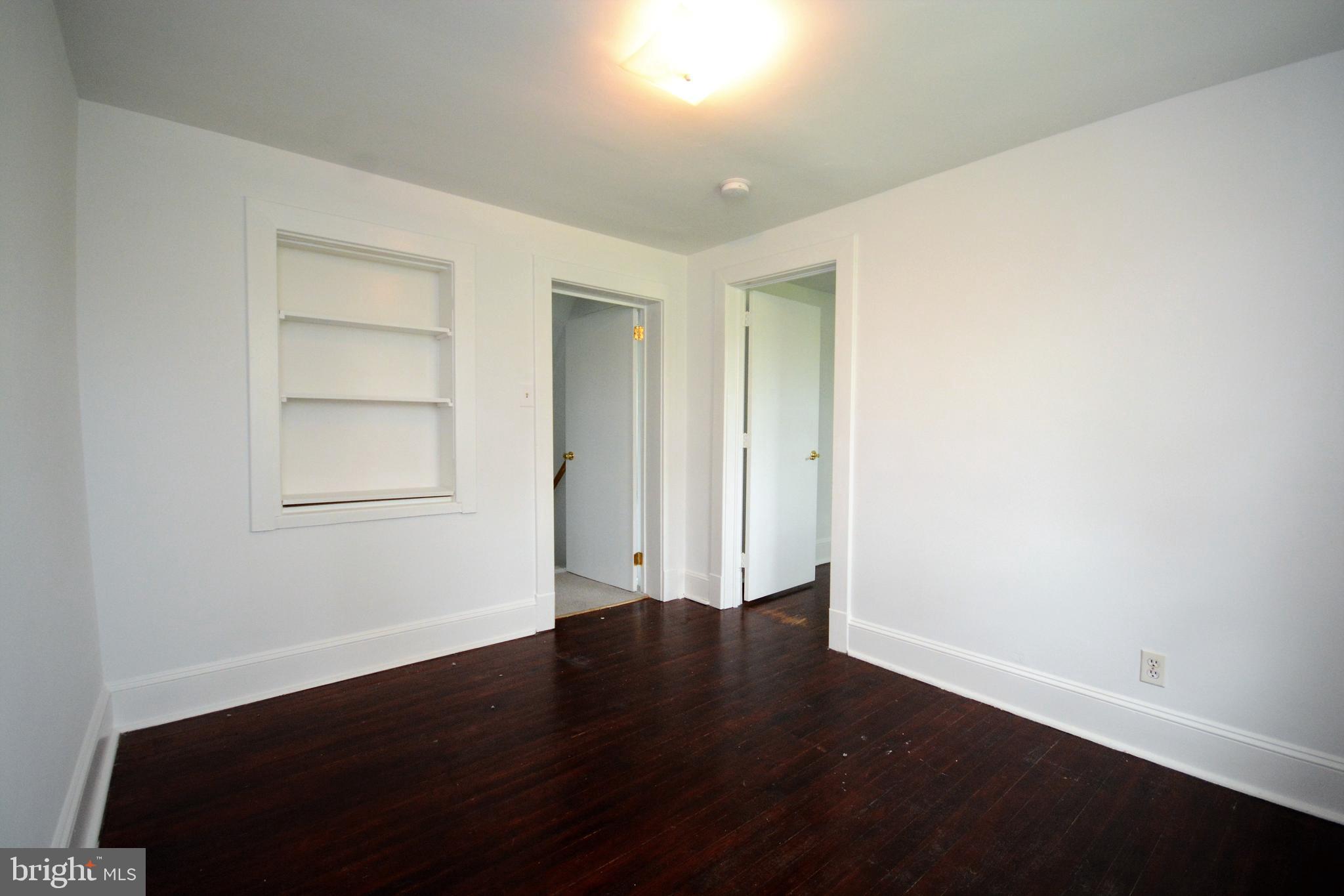 12108 Auburn Road Thurmont, MD 21788 - Photo 26 of 33 a view of an empty room with wooden floor and a window