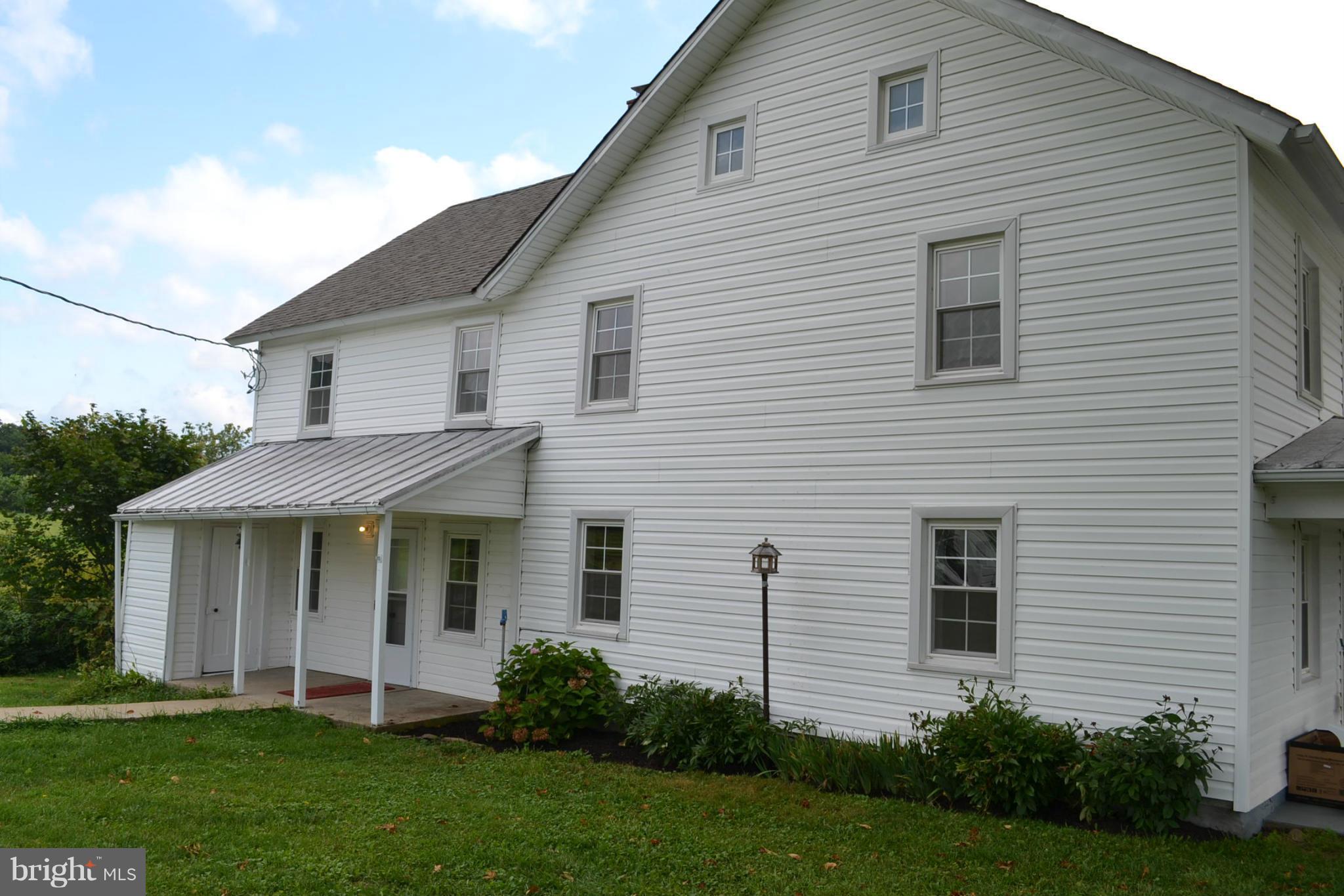 12108 Auburn Road Thurmont, MD 21788 - Photo 27 of 33 a view of a white house next to a yard