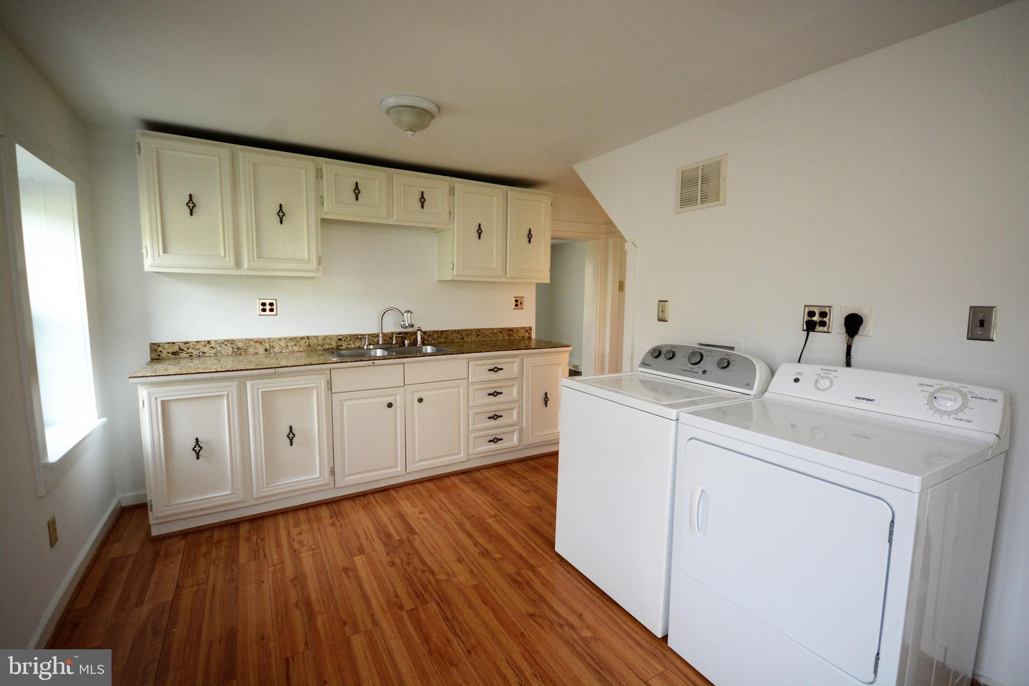 12108 Auburn Road Thurmont, MD 21788 - Photo 8 of 33 a utility room with cabinets washer and dryer