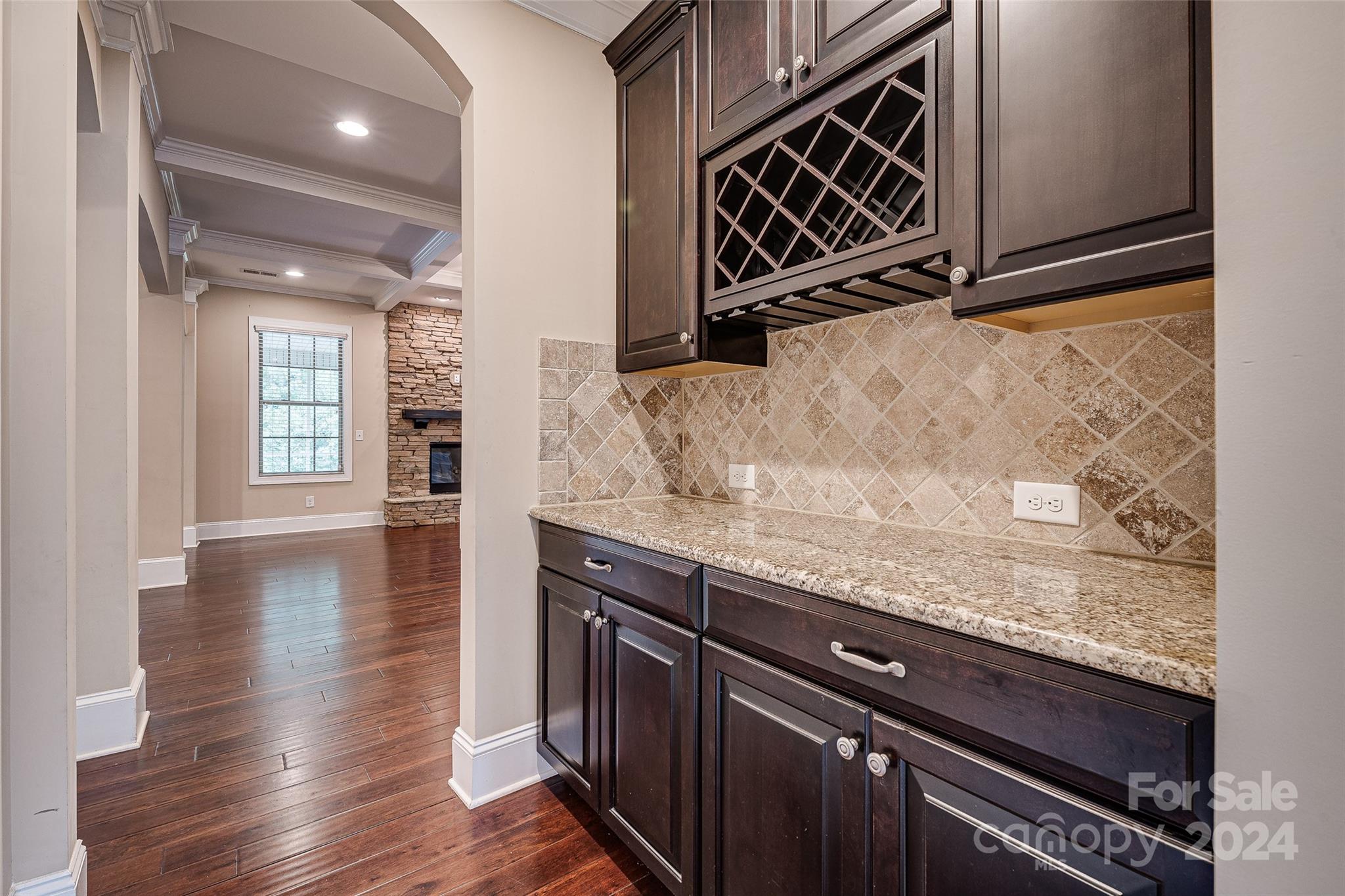13021 Pumpkin Way Drive Mint Hill, NC 28227 - Photo 11 of 41 a kitchen with granite countertop a stove and a wooden floor