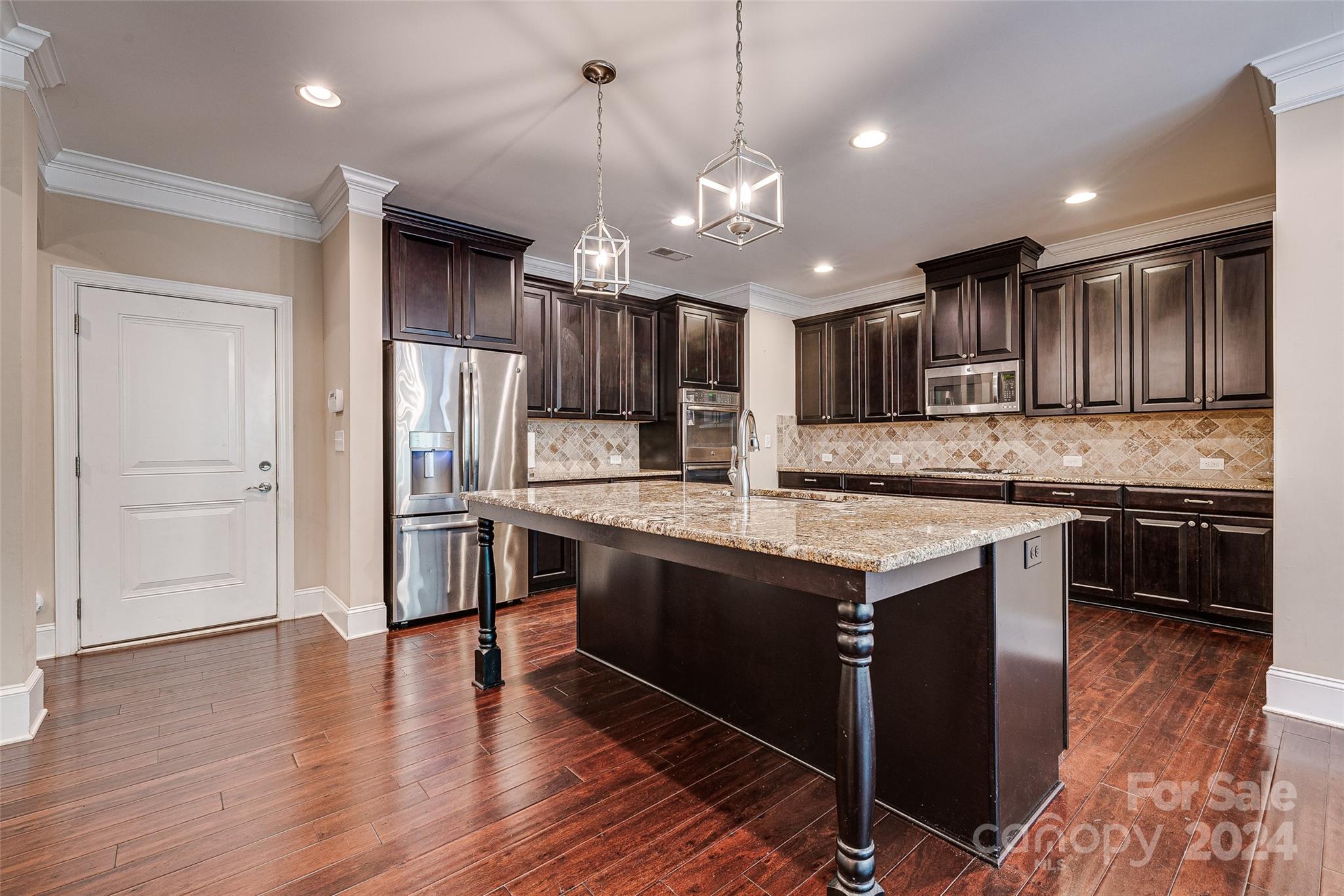 13021 Pumpkin Way Drive Mint Hill, NC 28227 - Photo 12 of 41 a kitchen with stainless steel appliances granite countertop a stove refrigerator and cabinets
