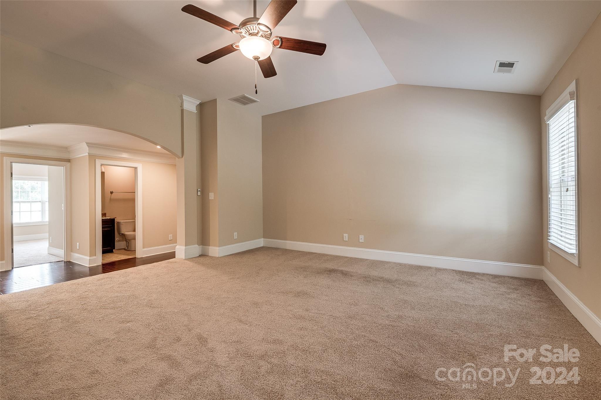 13021 Pumpkin Way Drive Mint Hill, NC 28227 - Photo 22 of 41 an empty room with chandelier fan and windows