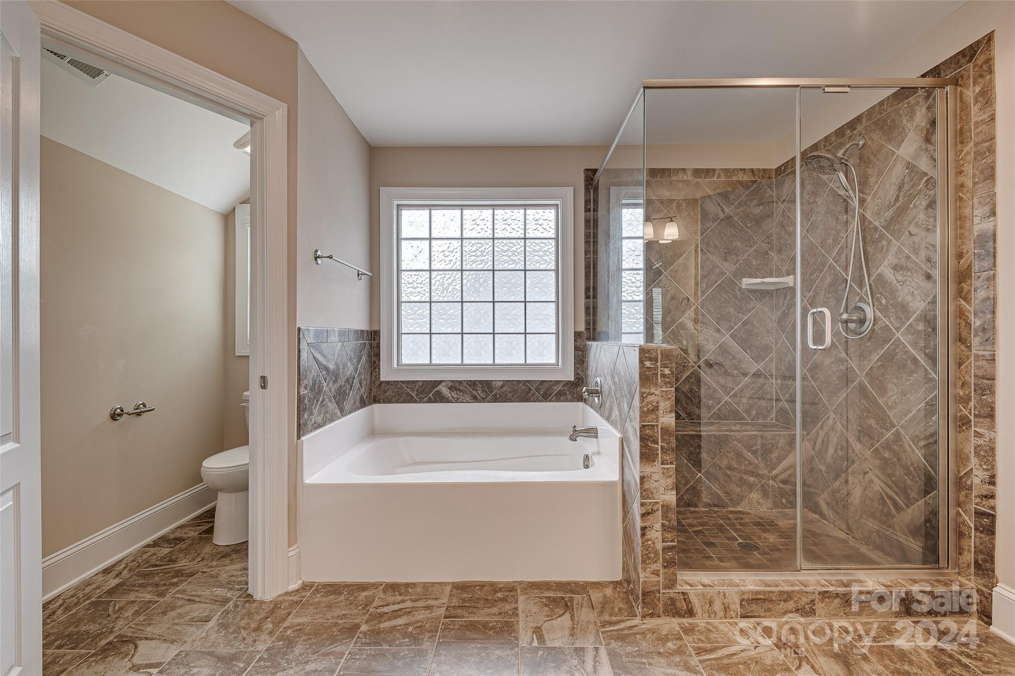 13021 Pumpkin Way Drive Mint Hill, NC 28227 - Photo 34 of 41 a bathroom with a bathtub and a shower