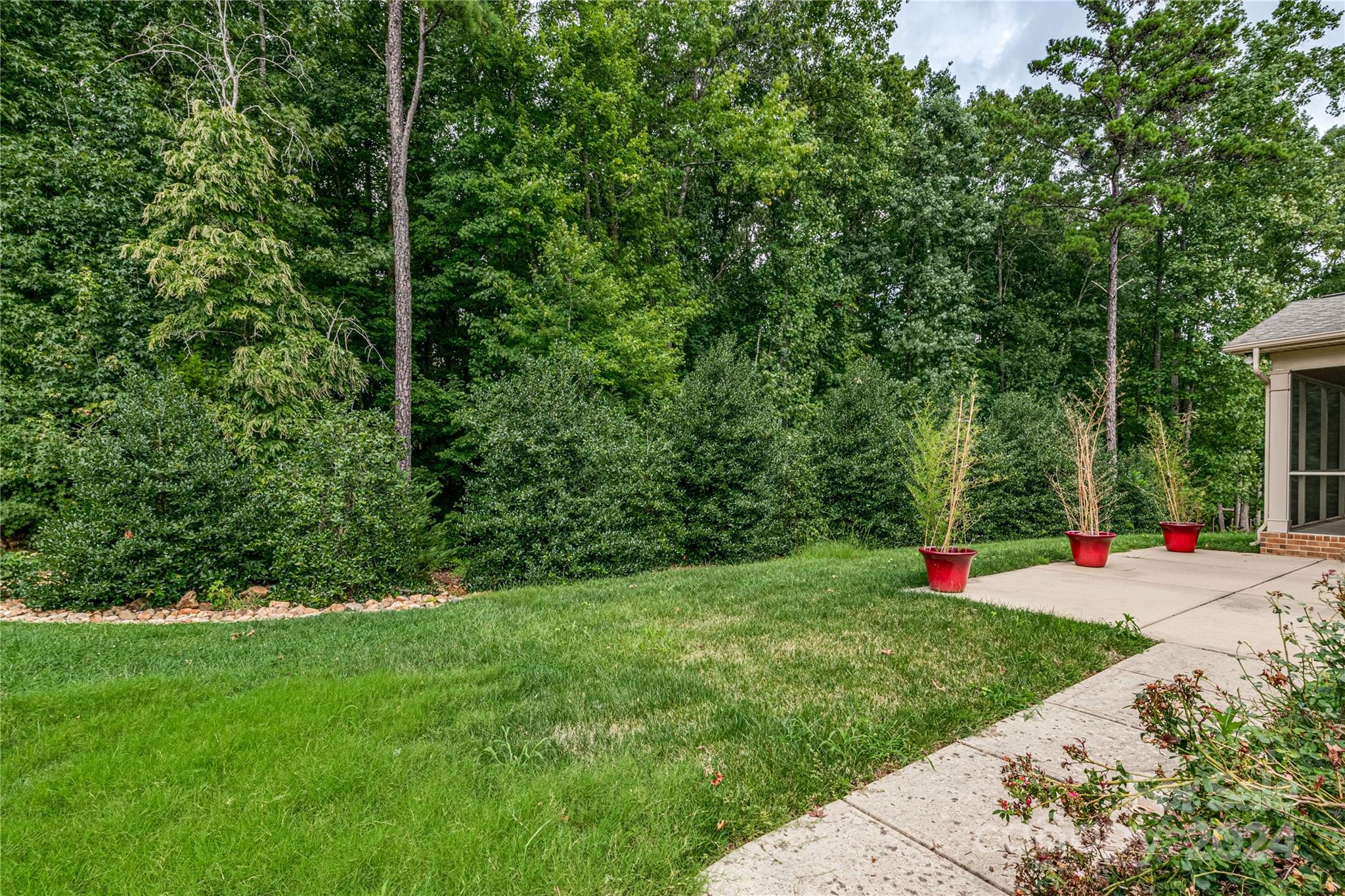 13021 Pumpkin Way Drive Mint Hill, NC 28227 - Photo 39 of 41 a view of green field with trees in the background