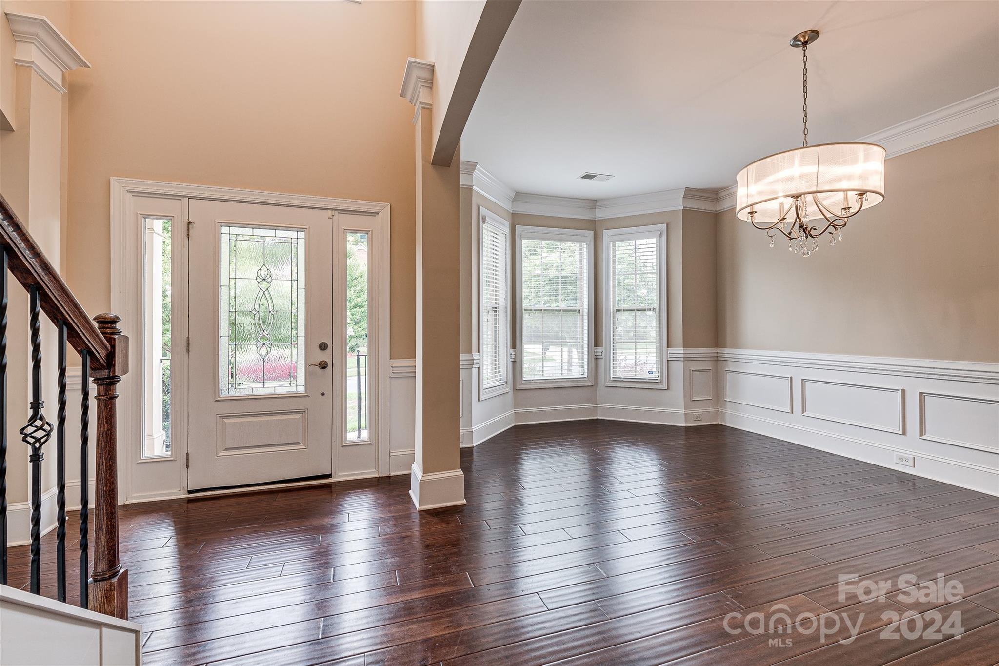 13021 Pumpkin Way Drive Mint Hill, NC 28227 - Photo 4 of 41 a view of an empty room with wooden floor and a window