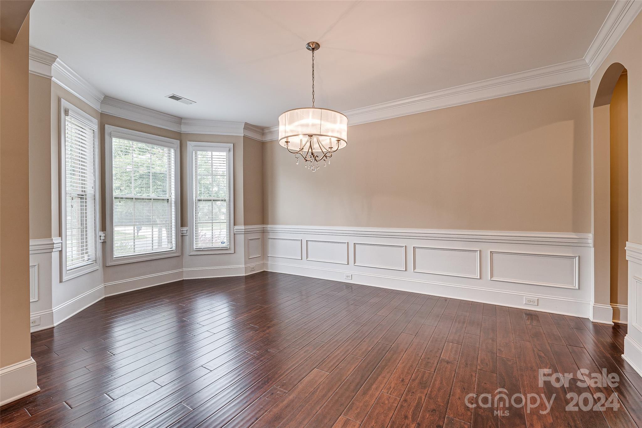 13021 Pumpkin Way Drive Mint Hill, NC 28227 - Photo 6 of 41 a view of an empty room with wooden floor and a window