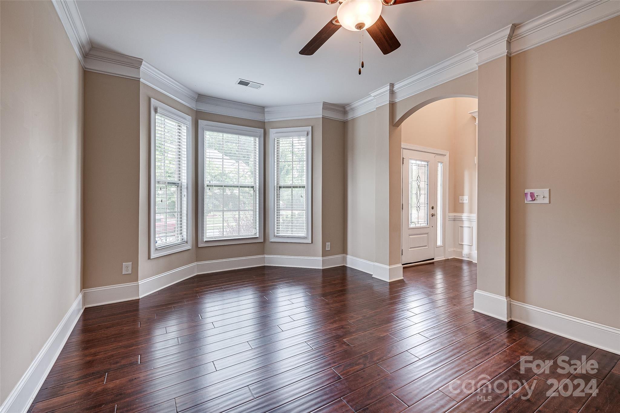 13021 Pumpkin Way Drive Mint Hill, NC 28227 - Photo 7 of 41 a view of an empty room with wooden floor and a window