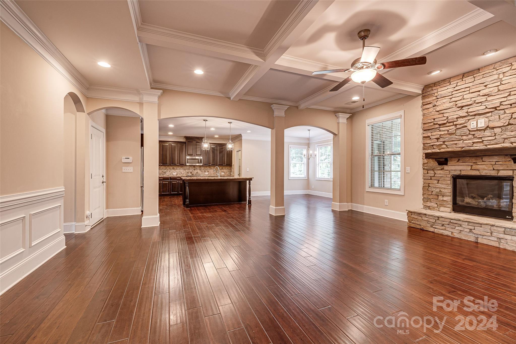 13021 Pumpkin Way Drive Mint Hill, NC 28227 - Photo 9 of 41 wooden floor in an empty room with a fireplace and wooden floor