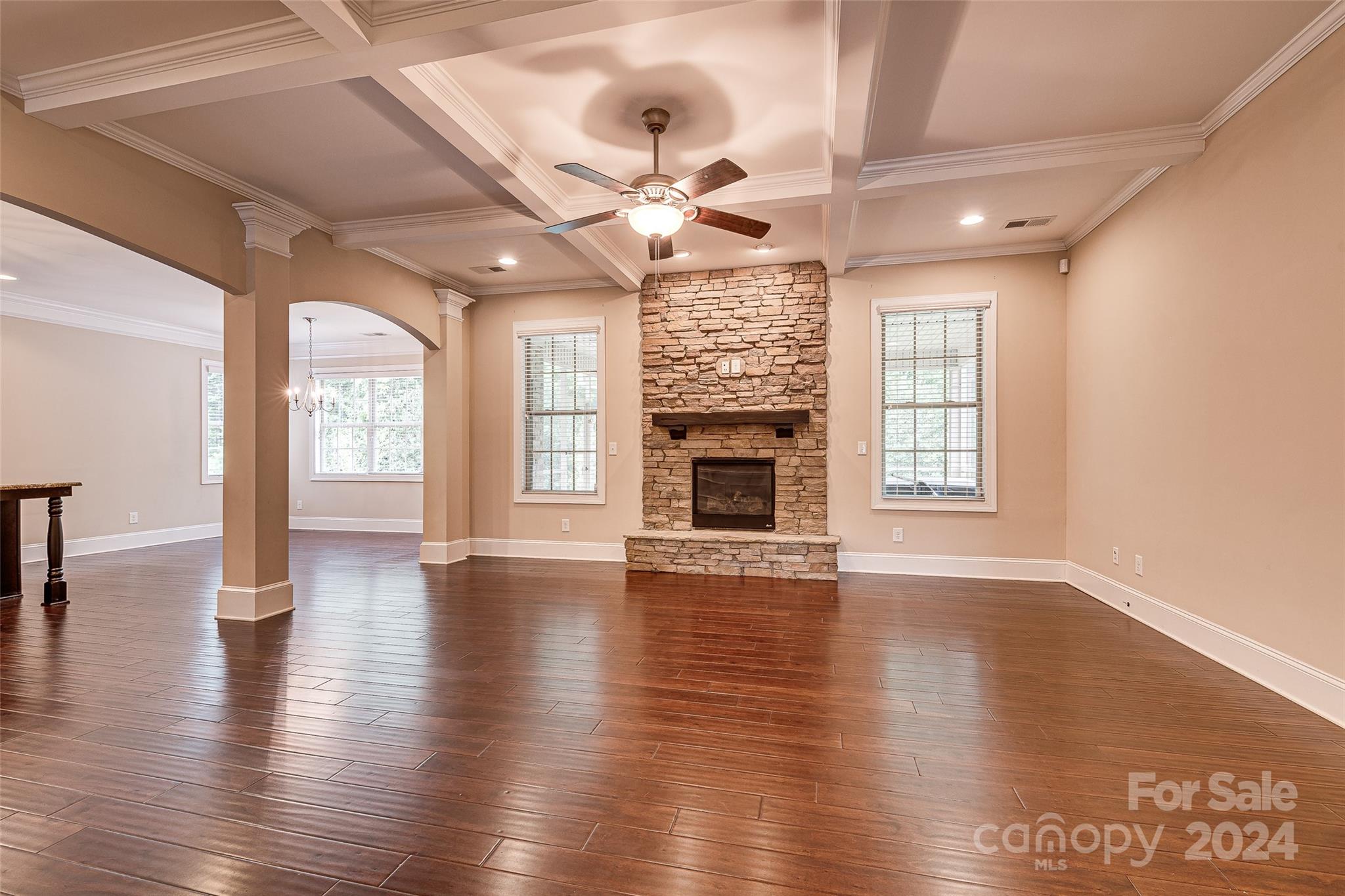 13021 Pumpkin Way Drive Mint Hill, NC 28227 - Photo 10 of 41 an empty room with wooden floor fireplace and windows