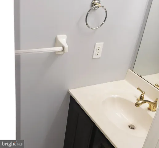 a view of a brick building next to a yard