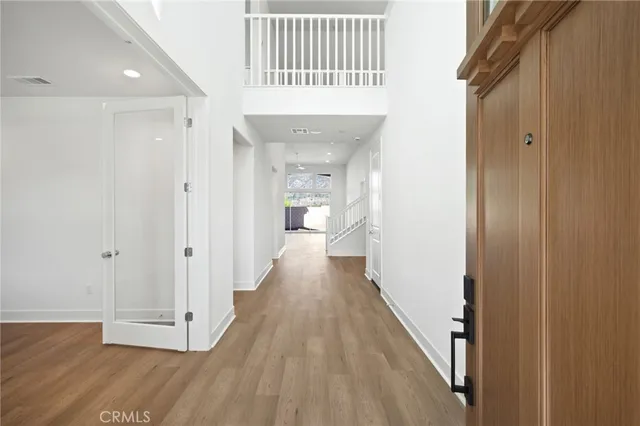 a kitchen with stainless steel appliances granite countertop a sink stove refrigerator and cabinets