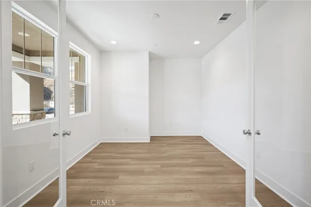 a kitchen with kitchen island a stove a sink and a refrigerator
