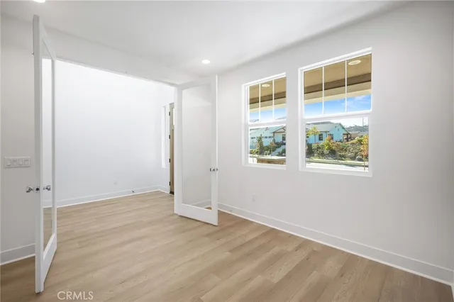a view of kitchen with kitchen island stainless steel appliances refrigerator stove microwave and cabinets
