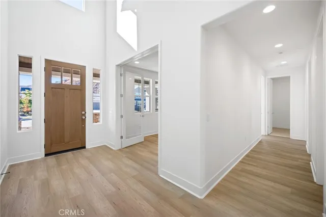 a kitchen with granite countertop white cabinets and stainless steel appliances