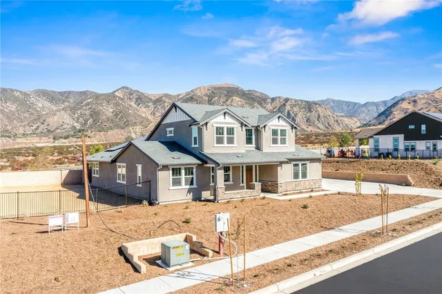 a front view of a house with a ocean view