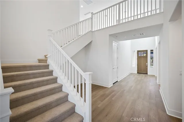 a view of house with yard and ocean view