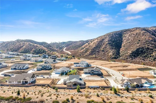 a kitchen with kitchen island white cabinets appliances and a sink