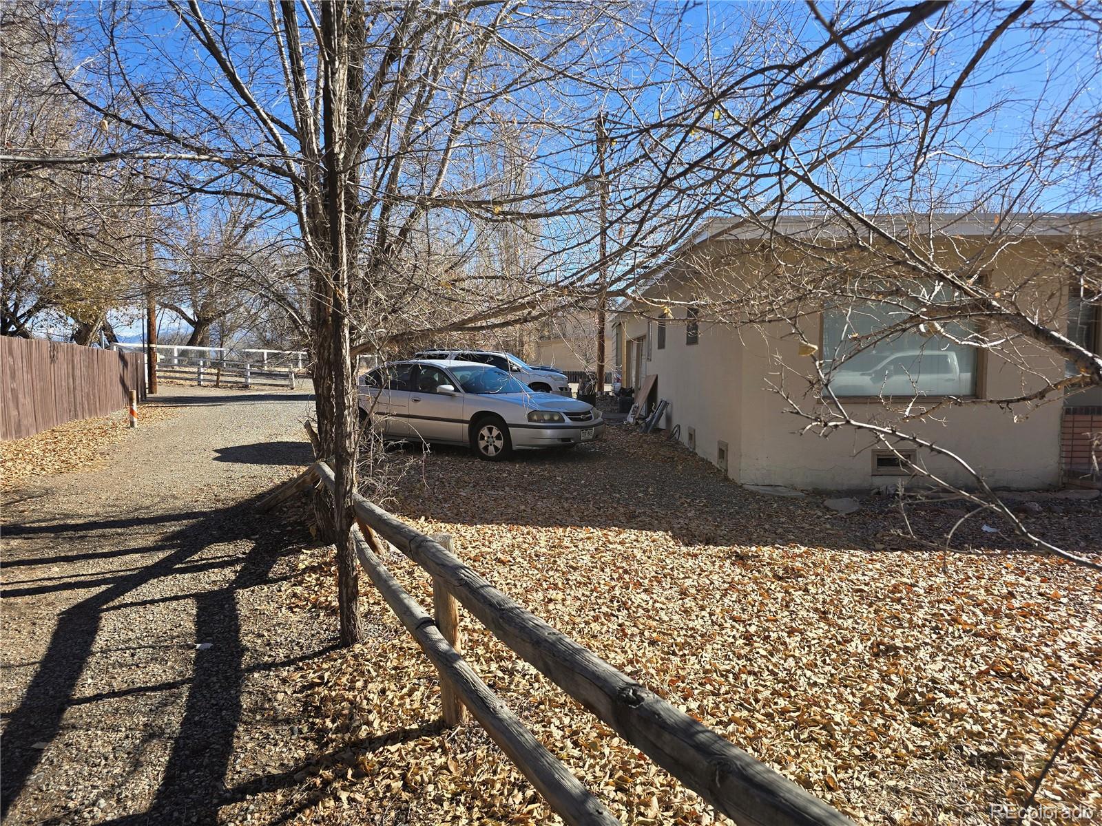 80 El Rio Drive, Unit 80 Alamosa, CO 81101 - Photo 10 of 12 a view of a backyard with wooden fence