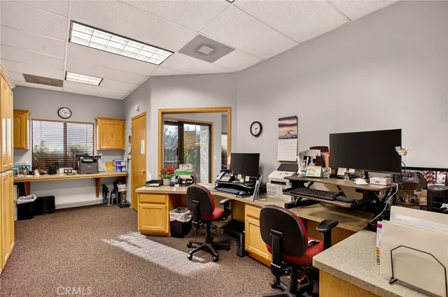 a view of a workspace with furniture and a livingroom
