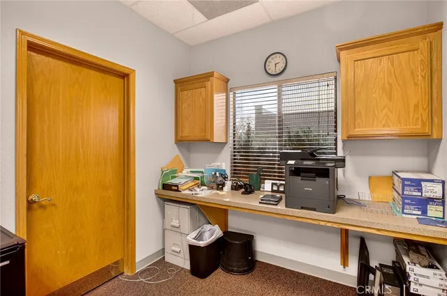 a kitchen with a sink cabinets and window