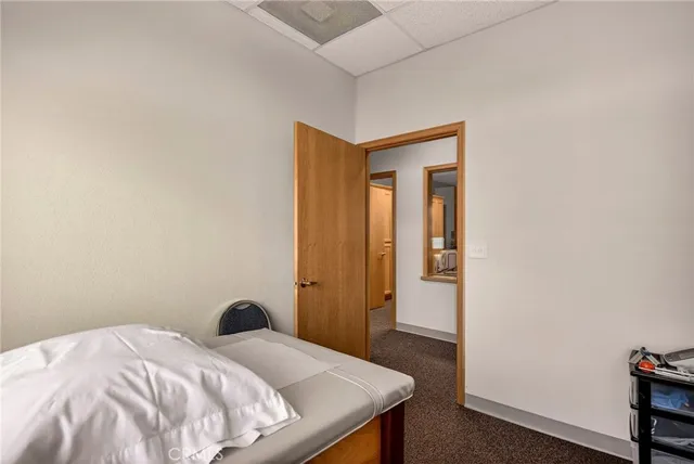 a bedroom with a bed and a table in it