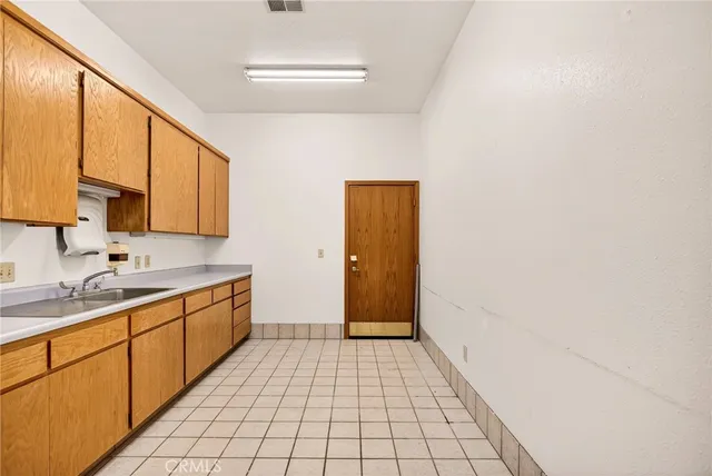 a bathroom with a sink a vanity and a mirror