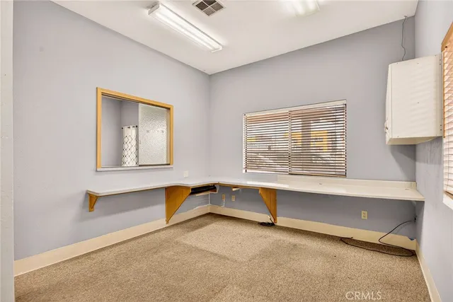 a bathroom with a sink toilet and mirror