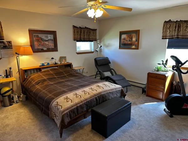 a bedroom with a bed and a lamp