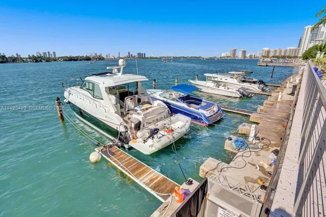 a view of a house with pool and chairs