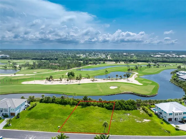 a view of a golf course with a big yard