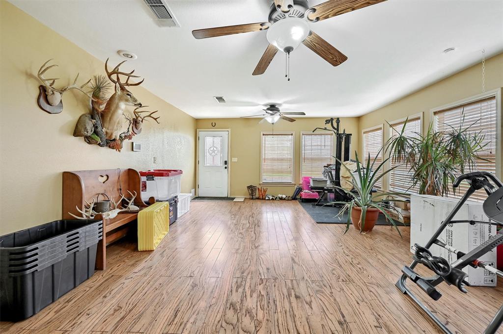 3138 Scarbrough Road Sadler, TX 76264 - Photo 11 of 40 a living room with furniture and wooden floor