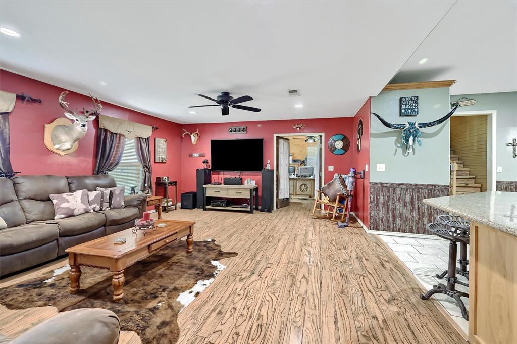3138 Scarbrough Road Sadler, TX 76264 - Photo 13 of 40 a living room with furniture and a flat screen tv