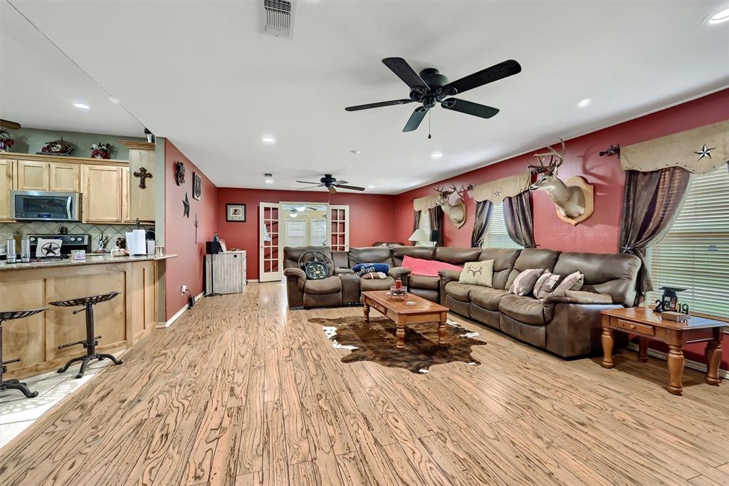 3138 Scarbrough Road Sadler, TX 76264 - Photo 15 of 40 a living room with furniture and kitchen view