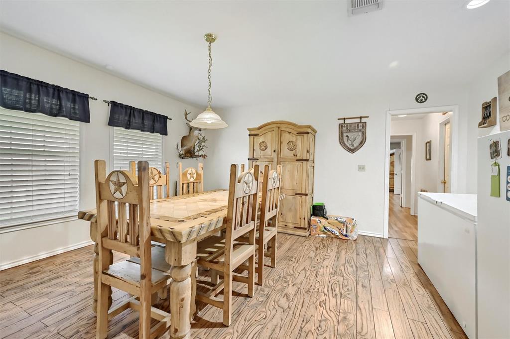 3138 Scarbrough Road Sadler, TX 76264 - Photo 20 of 40 a view of a dining room with furniture window and wooden floor