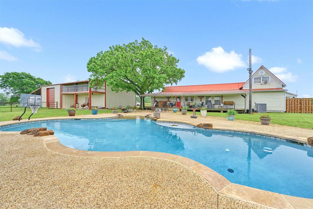 3138 Scarbrough Road Sadler, TX 76264 - Photo 2 of 40 a view of swimming pool with outdoor seating and yard