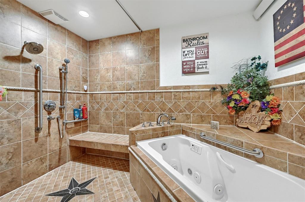 3138 Scarbrough Road Sadler, TX 76264 - Photo 24 of 40 a bathroom with a tub a sink and a shower