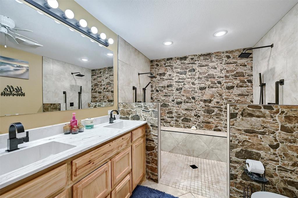 3138 Scarbrough Road Sadler, TX 76264 - Photo 30 of 40 a bathroom with a sink mirror and vanity