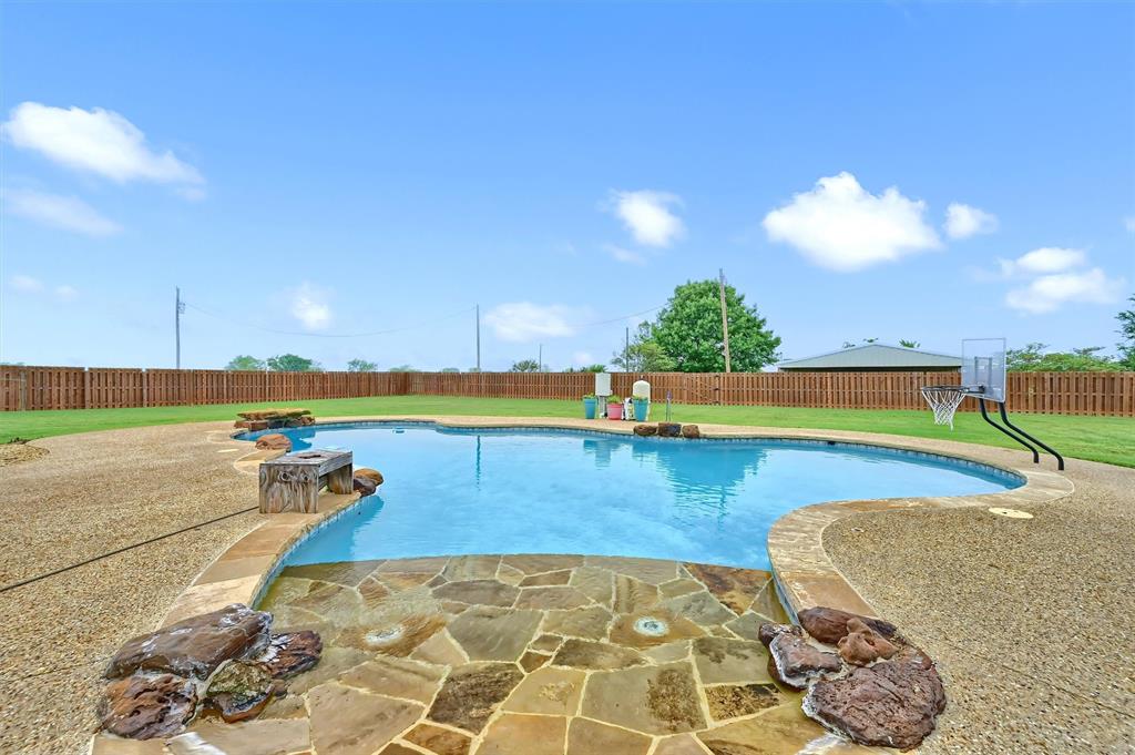 3138 Scarbrough Road Sadler, TX 76264 - Photo 7 of 40 a view of a swimming pool and an outdoor space