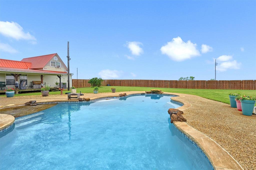 3138 Scarbrough Road Sadler, TX 76264 - Photo 9 of 40 a view of a house with swimming pool and sitting area