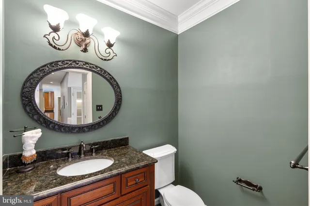 a bedroom with a bed dresser and a large window