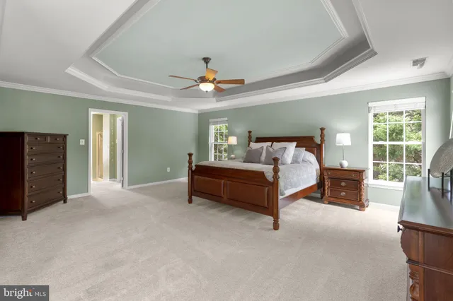 a bathroom with a sink a toilet and shower curtain